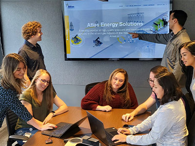 An image of Atlas Energy Solutions Employees at an event